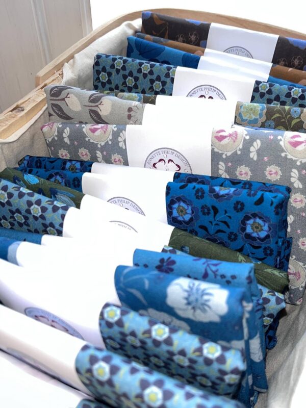 Blue and gray cotton fabrics in a basket